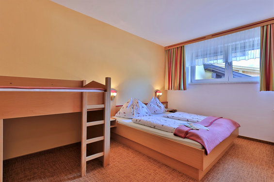 Bedroom at the apartement Schneewitchen at hotel Garni Zerza